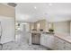 Open-concept kitchen boasts modern appliances and a seamless flow to the adjacent living spaces at 1514 Vandam St, The Villages, FL 32162