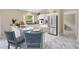 Kitchen featuring stainless steel appliances, breakfast bar, and ample counter space at 1514 Vandam St, The Villages, FL 32162