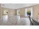 Spacious living room offers ample natural light and a view of the outdoors at 1514 Vandam St, The Villages, FL 32162