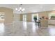 Spacious living area with modern tile, ample natural light, and access to the lanai at 1514 Vandam St, The Villages, FL 32162
