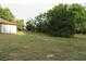 Exterior shot of backyard with scattered trees and grass at 15587 Se 150Th Ave, Weirsdale, FL 32195