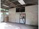 Barn with a corrugated metal exterior and an open door at 15587 Se 150Th Ave, Weirsdale, FL 32195