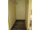 Walk-in closet with wooden floors and ample storage space at 15587 Se 150Th Ave, Weirsdale, FL 32195