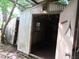 Shed with corrugated metal walls and open door, ready for storage or remodeling at 15587 Se 150Th Ave, Weirsdale, FL 32195