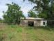 Exterior view of a large shed in a grassy yard at 15587 Se 150Th Ave, Weirsdale, FL 32195
