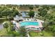 Lovely community pool with ample seating, umbrellas and shade for residents to enjoy at 15837 Hidden Lake Cir, Clermont, FL 34711