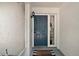 Cozy entryway with a stylish blue front door and welcome mat at 15837 Hidden Lake Cir, Clermont, FL 34711