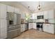 Modern kitchen with stainless steel appliances, sleek countertops, and ample cabinet space at 15837 Hidden Lake Cir, Clermont, FL 34711