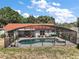 Backyard pool with screened enclosure and plenty of seating areas for lounging and entertaining at 15837 Hidden Lake Cir, Clermont, FL 34711