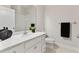Clean bathroom with white vanity, sink, and toilet, and a shower with tub at 17112 Goldcrest Loop, Clermont, FL 34714