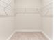 Empty walk-in closet with carpet flooring and wire shelving for storage at 17112 Goldcrest Loop, Clermont, FL 34714