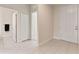 Hallway features neutral walls, tile flooring, and doorways leading to various rooms at 17112 Goldcrest Loop, Clermont, FL 34714