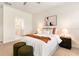 Stylish main bedroom with modern decor and cozy seating area at 17112 Goldcrest Loop, Clermont, FL 34714