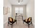 Cozy office featuring neutral walls, a ceiling fan, and modern black chairs with yellow accents at 17112 Goldcrest Loop, Clermont, FL 34714