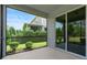 Screened-in patio with a view of well-maintained landscaping and a modern home exterior at 17112 Goldcrest Loop, Clermont, FL 34714