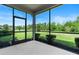 A screened patio providing outdoor living space with views of the landscaped yard at 17112 Goldcrest Loop, Clermont, FL 34714