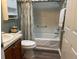 Clean bathroom with shower and tub and coordinated décor at 1723 Banberry Run, The Villages, FL 32162