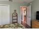 Comfortable bedroom with closet and shelving and neutral décor at 1723 Banberry Run, The Villages, FL 32162