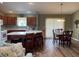 Bright kitchen with wood cabinets, breakfast bar, and adjacent dining area for Gathering gatherings at 1723 Banberry Run, The Villages, FL 32162