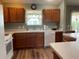 Functional kitchen with ample counter space, wood cabinets, and modern appliances at 1723 Banberry Run, The Villages, FL 32162