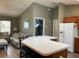 View of open-concept kitchen and living room featuring neutral colors and hardwood style floors at 1723 Banberry Run, The Villages, FL 32162