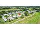Aerial view of home and community featuring a golf course at 1726 W Schwartz Blvd, Lady Lake, FL 32159