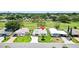 Aerial view of home and community with well-manicured lawns and golf course at 1726 W Schwartz Blvd, Lady Lake, FL 32159