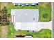 Overhead view of home showing roof, driveway and green lawn at 1726 W Schwartz Blvd, Lady Lake, FL 32159