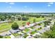 Wide aerial view of home and community featuring a golf course at 1726 W Schwartz Blvd, Lady Lake, FL 32159
