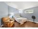 Cozy bedroom with hardwood floors, a window, and relaxing atmosphere at 1726 W Schwartz Blvd, Lady Lake, FL 32159