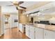 Spacious kitchen with a large breakfast bar and view into the living room area at 1726 W Schwartz Blvd, Lady Lake, FL 32159