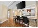 Modern kitchen with stone accents, island seating, and pendant lighting at 1726 W Schwartz Blvd, Lady Lake, FL 32159
