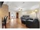Open floor plan living room with stone accent wall and hardwood floors at 1726 W Schwartz Blvd, Lady Lake, FL 32159