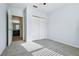 Bedroom with carpet, a ceiling fan, and a closet in the background at 185 Hamlet Loop, Davenport, FL 33837