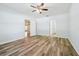 Large bedroom featuring two closets, a ceiling fan, and neutral walls complemented by light-colored wood flooring at 185 Hamlet Loop, Davenport, FL 33837