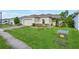 Charming single-Gathering home with well-kept lawn, attached garage, and inviting curb appeal at 185 Hamlet Loop, Davenport, FL 33837