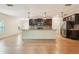 Modern kitchen with granite countertops, stainless steel appliances, and center island at 185 Hamlet Loop, Davenport, FL 33837