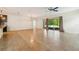 Spacious living room featuring tile flooring, ceiling fan, and sliding glass doors at 185 Hamlet Loop, Davenport, FL 33837