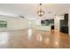 Open-concept living space with large tile floors and kitchen island view at 185 Hamlet Loop, Davenport, FL 33837