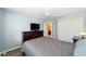 Bedroom with wood floors, neutral paint, and a closet with white trim at 1910 Quiet Oak Ct, The Villages, FL 32162