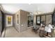 Relax in this sunroom featuring neutral colors, lots of natural light, and sliding glass doors at 1910 Quiet Oak Ct, The Villages, FL 32162