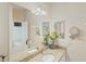 Bathroom showcasing dual sinks, granite countertop, and a decorative faucet with updated fixtures at 1963 Ladyfish Ave, The Villages, FL 32162