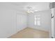 Bedroom with ceiling fan, closet, and shuttered window at 1963 Ladyfish Ave, The Villages, FL 32162