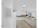 Well-lit kitchen featuring modern appliances and granite countertops at 1963 Ladyfish Ave, The Villages, FL 32162