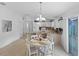Open concept kitchen and dining area with modern appliances and ample counter space at 1963 Ladyfish Ave, The Villages, FL 32162