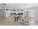 Spacious kitchen with white cabinetry, granite countertops, and an island with bar seating at 1963 Ladyfish Ave, The Villages, FL 32162
