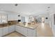 Bright, open-concept kitchen with stainless steel appliances and an island, perfect for entertaining at 1963 Ladyfish Ave, The Villages, FL 32162