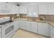 A bright kitchen with modern appliances and ample counter space at 1963 Ladyfish Ave, The Villages, FL 32162