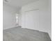 A large bedroom with carpet and a closet with folding doors at 2025 Axel St, Minneola, FL 34715