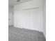 An empty bedroom with a closet with folding doors at 2025 Axel St, Minneola, FL 34715